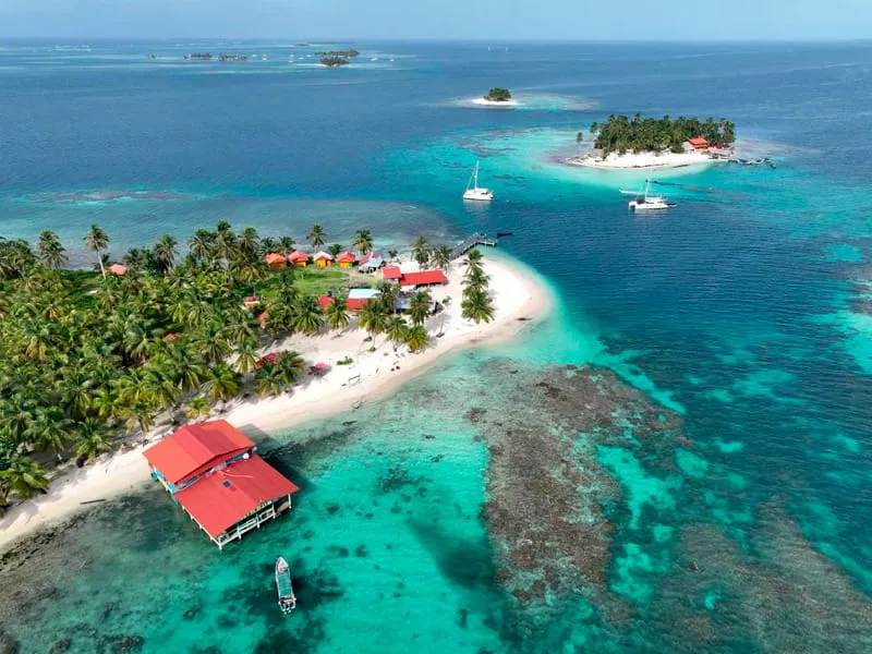 Aerial view of islands, reefs and red-roofed buildings in Guna Yala